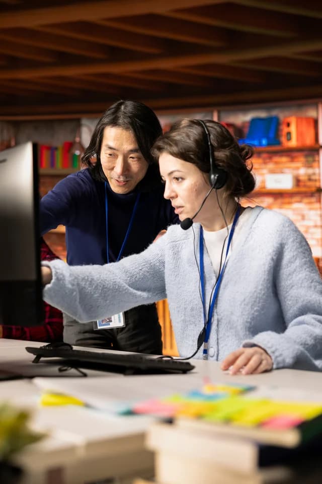 Colleagues working together at a computer