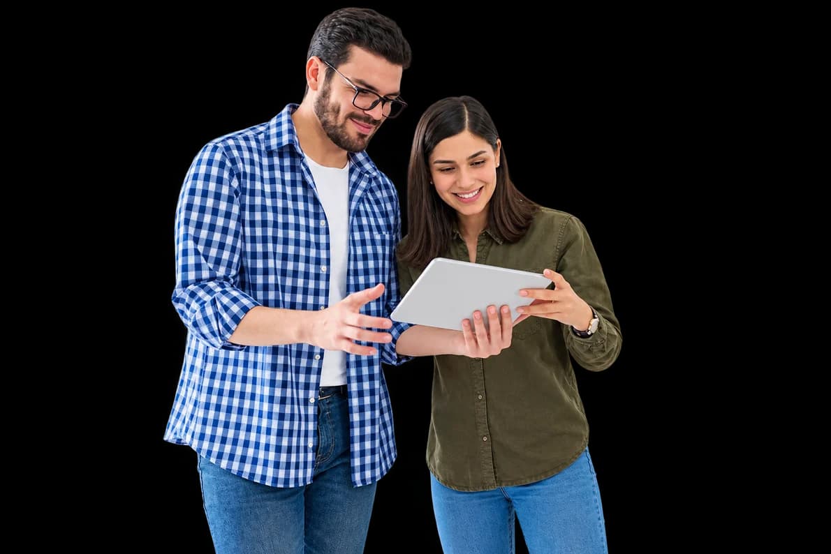 Two colleagues reviewing reports on a tablet